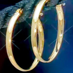 7/8 high polished hoop earrings 18 K yellow gold